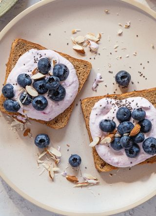 Blueberries and yoghurt on toast with chia seeds