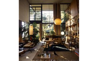 The living room of the Case Study House No. 8 in Santa Monica, California, which the couple designed and lived in. Pictured: the house's living room.