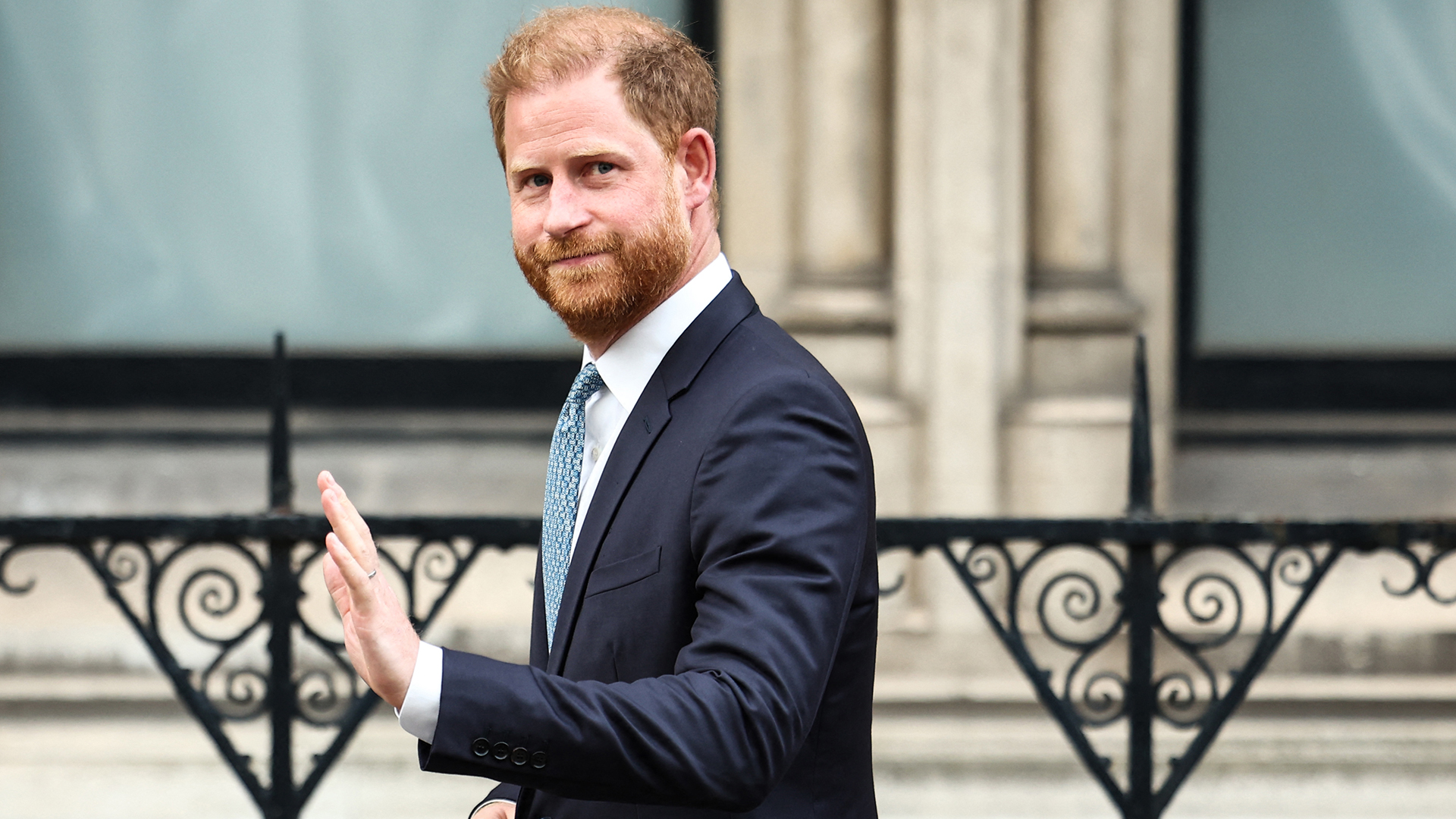 TOPSHOT - Britain&#039;s Prince Harry, Duke of Sussex waves as he leaves the High Court, in central London, on April 8, 2025 after an hearing about a decision of the British Government to downgrade his personal security during visits in Britain. Prince Harry&#039;s lawyer outlined in court threats made against him, as King Charles&#039;s youngest son appealed on April 8, 2025 against an &quot;unjustified&quot; decision to restrict his police protection in the UK. Harry, who has been angered by the government&#039;s decision, watched proceedings unfold from inside London&#039;s Royal Courts of Justice during a rare visit to London. (Photo by HENRY NICHOLLS / AFP) (Photo by HENRY NICHOLLS/AFP via Getty Images) 