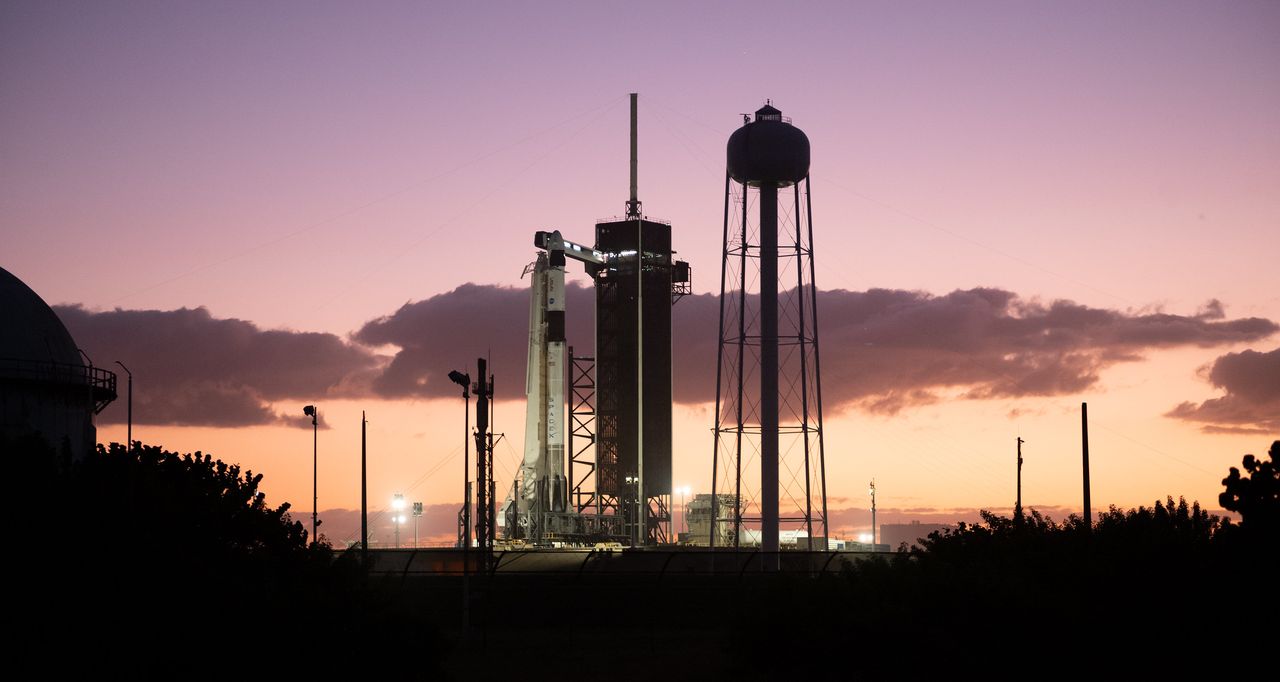 A SpaceX Falcon 9 rocket with the company's Crew Dragon spacecraft onboard is seen at sunset on the launch pad at Launch Complex 39A as preparations continue for the Crew-3 mission, Tuesday, Nov. 9, 2021, at NASA&rsquo;s Kennedy Space Center in Florida.