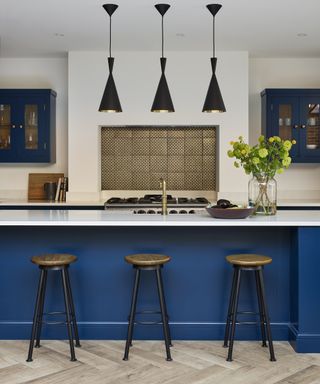 Blue kitchen island with quartz worktop
