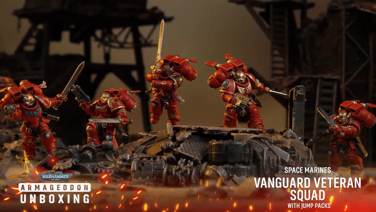 Warhammer 40K Space Marine models on a rocky battlefield