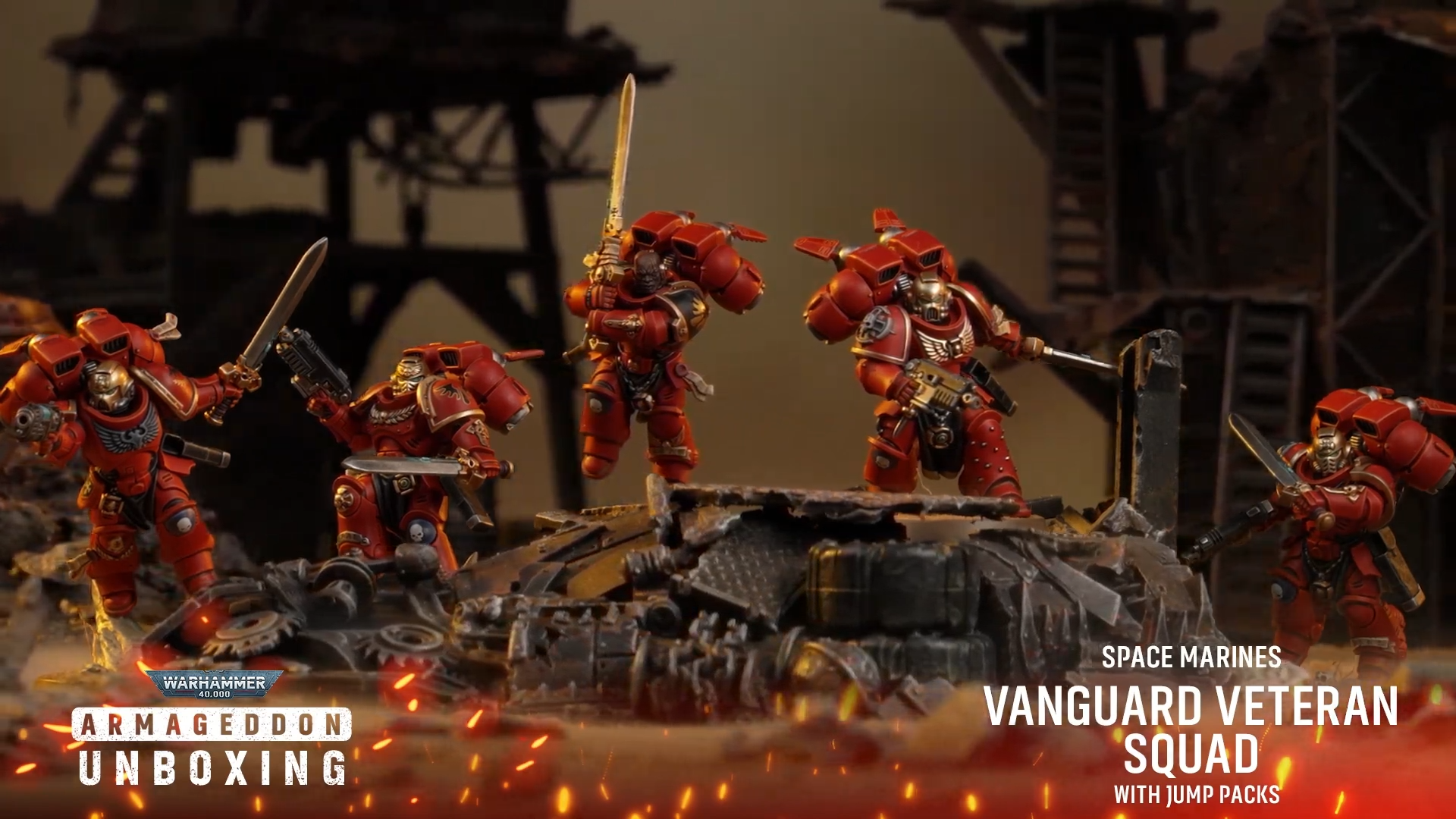 Warhammer 40K Space Marine models on a rocky battlefield
