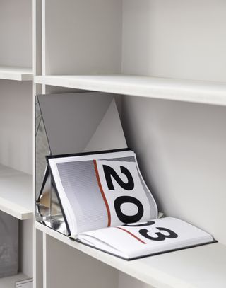 Open book on rotating bookcase shelf