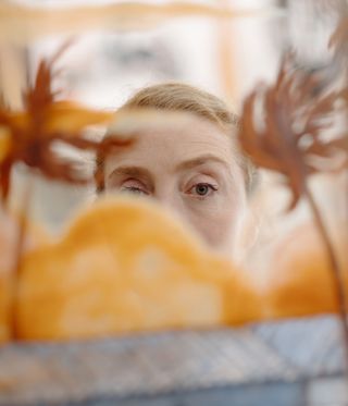 woman with red hair pictured in studio