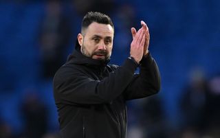 Roberto De Zerbi applauds the Brighton fans after a draw with Everton