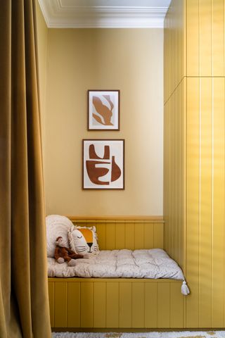 yellow painted millwork in a kids bedroom