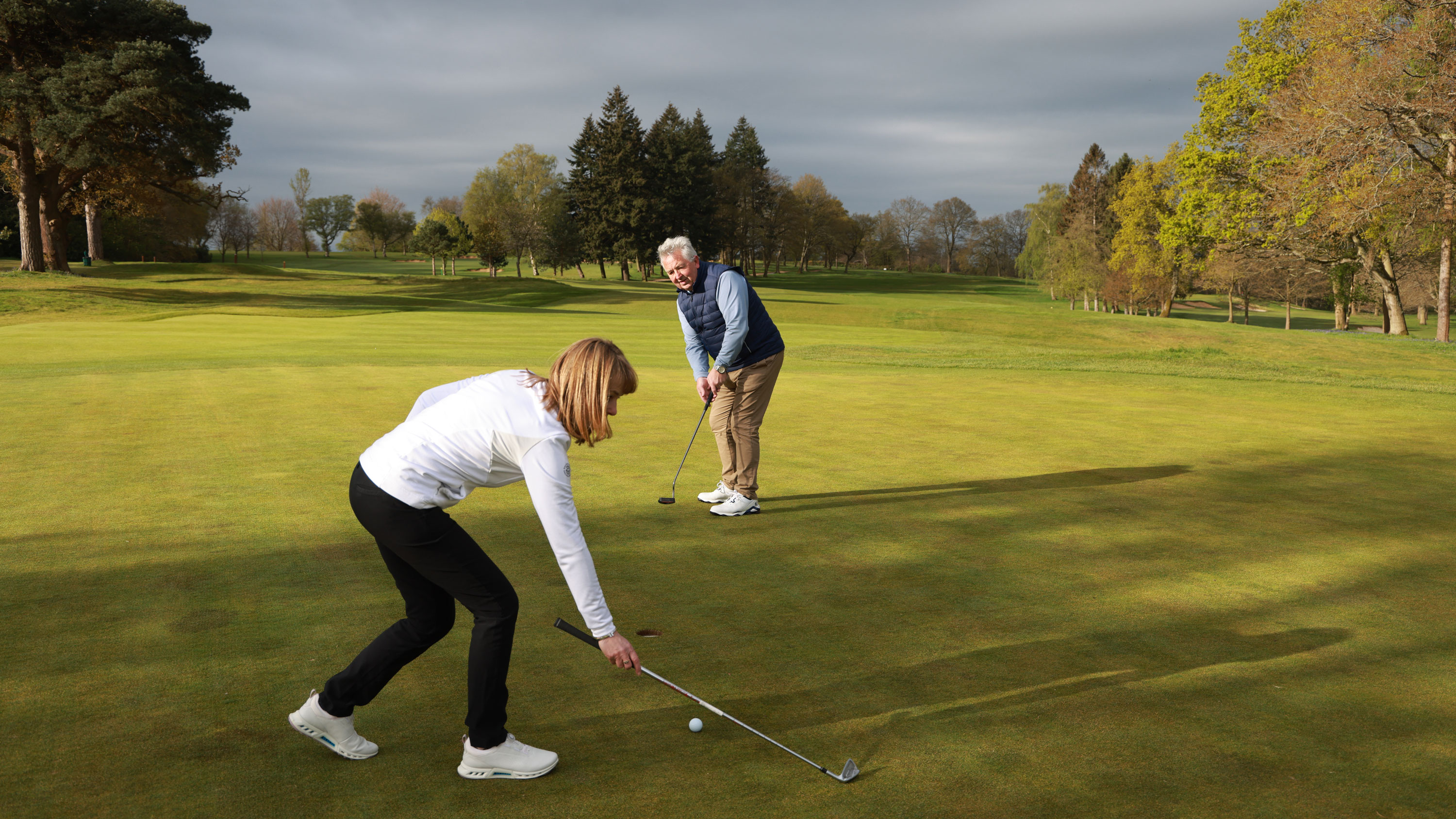 Lifting a club to stop a putt hitting it