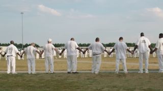 Inmates forming a human circle in The Alabama Solution