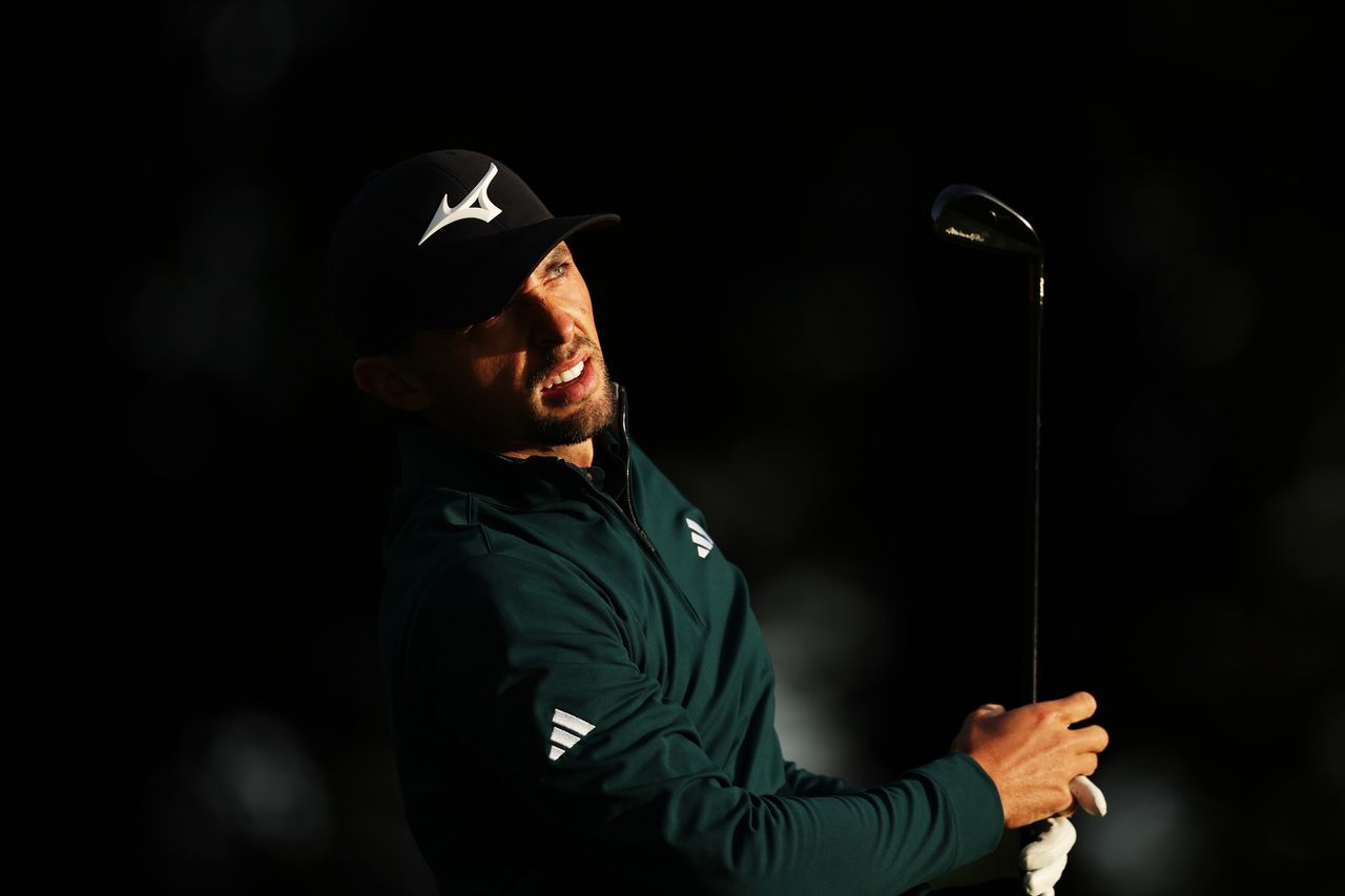 Marco Penge watches the ball flight of his 2-iron