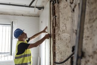 Mature construction worker in home renovations.