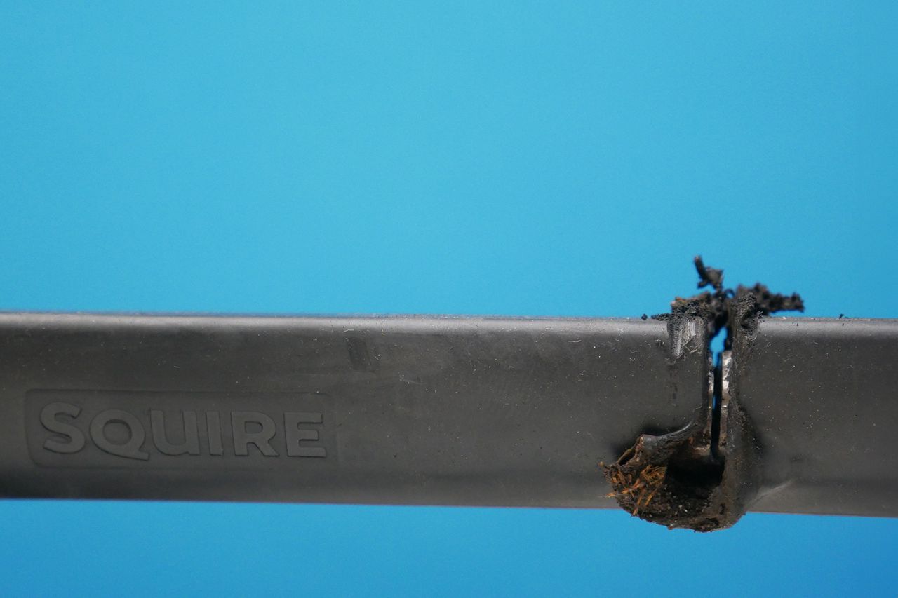 melted rubber and significant cut through the stronghold and angle grinder resistant lock from Squire.