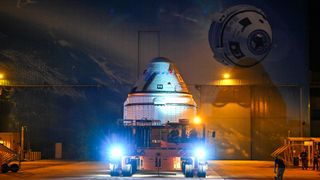 a cone-shaped spacecraft in the dark in front of a building. the spacecraft is on a trailer with lights shining in the dark. in the background, in shadow, is a building with an illustration of starliner on the side