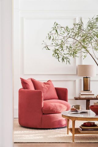 pink armchair in neutral living room