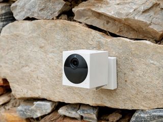 Wyze Cam Outdoor mounted on a rock