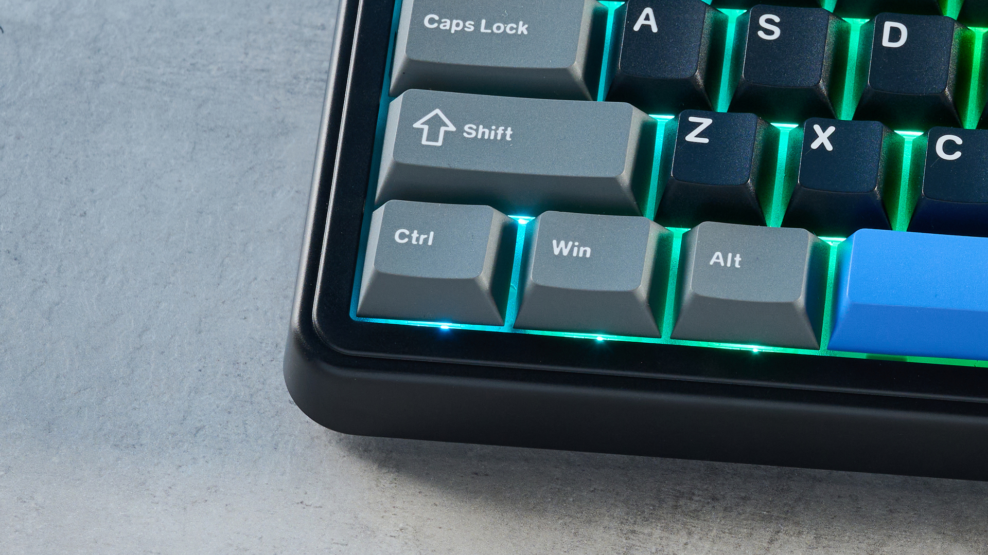 A black, gray and blue Epomaker HE65 Mag magnetic keyboard with Hall Effect switches
