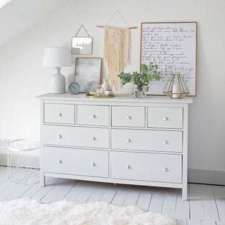 white themed bedroom with white drawer