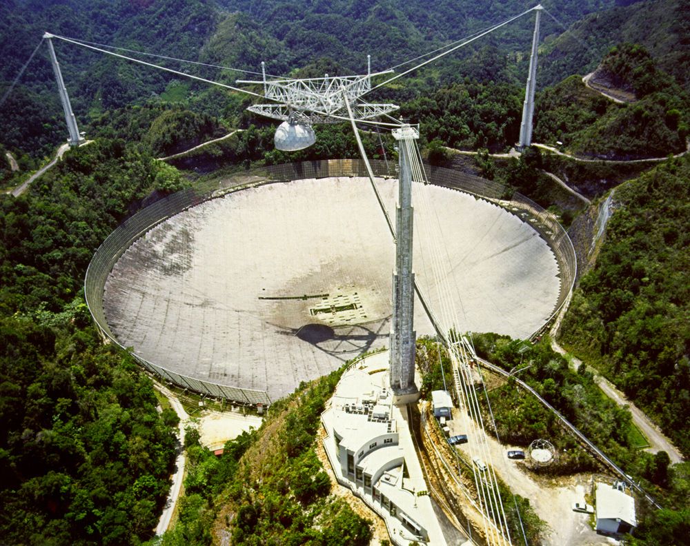 Scientists are using the Arecibo Observatory in Puerto Rico to study red dwarf stars — a campaign that detected odd radio signals coming from the vicinity of the red dwarf Ross 128 on May 12, 2017.