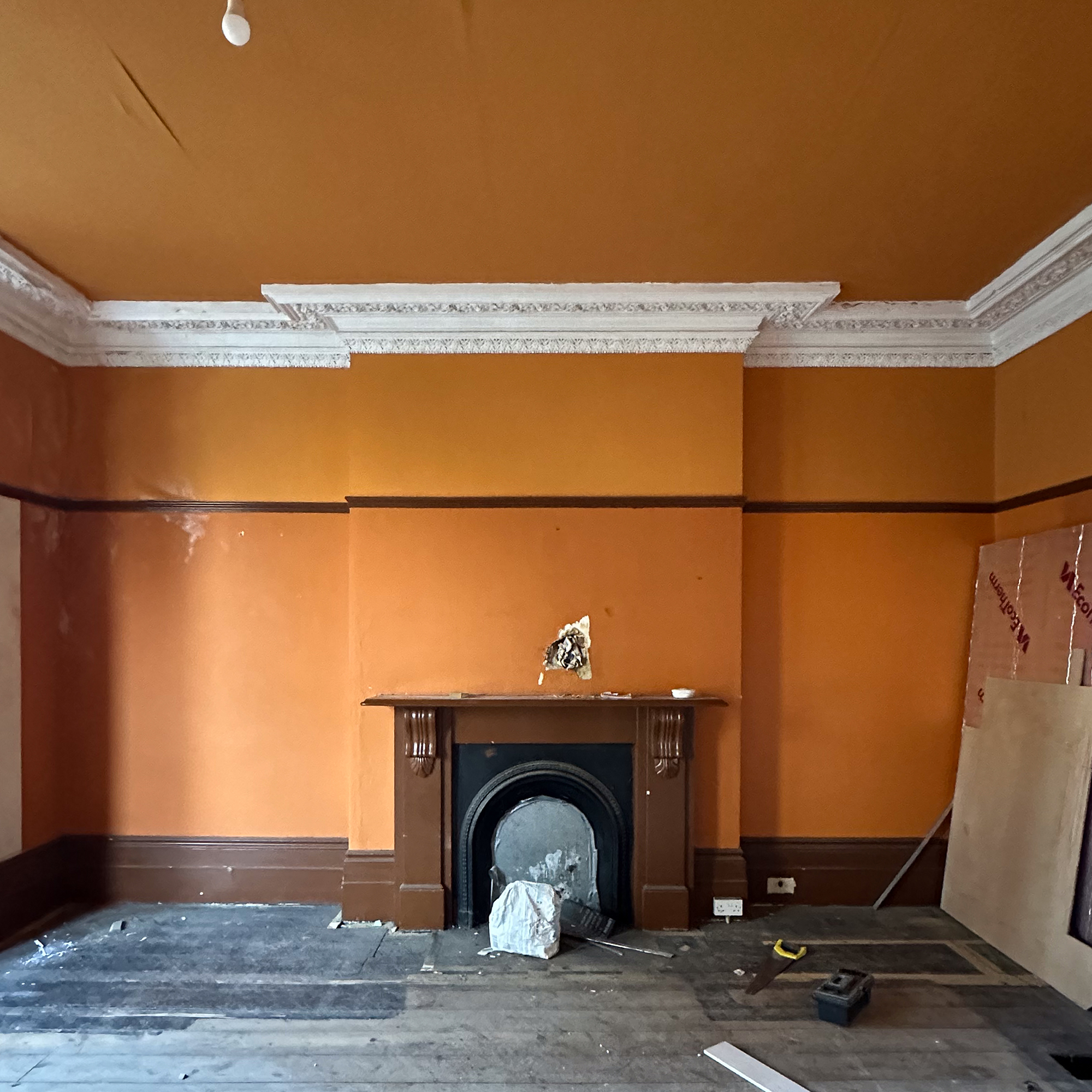 bedroom mid renovatin with marble fireplace