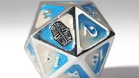close up of Esoteric-ebb themed D20 die with helmet instead of 20 face, metal edges, blue and white faces