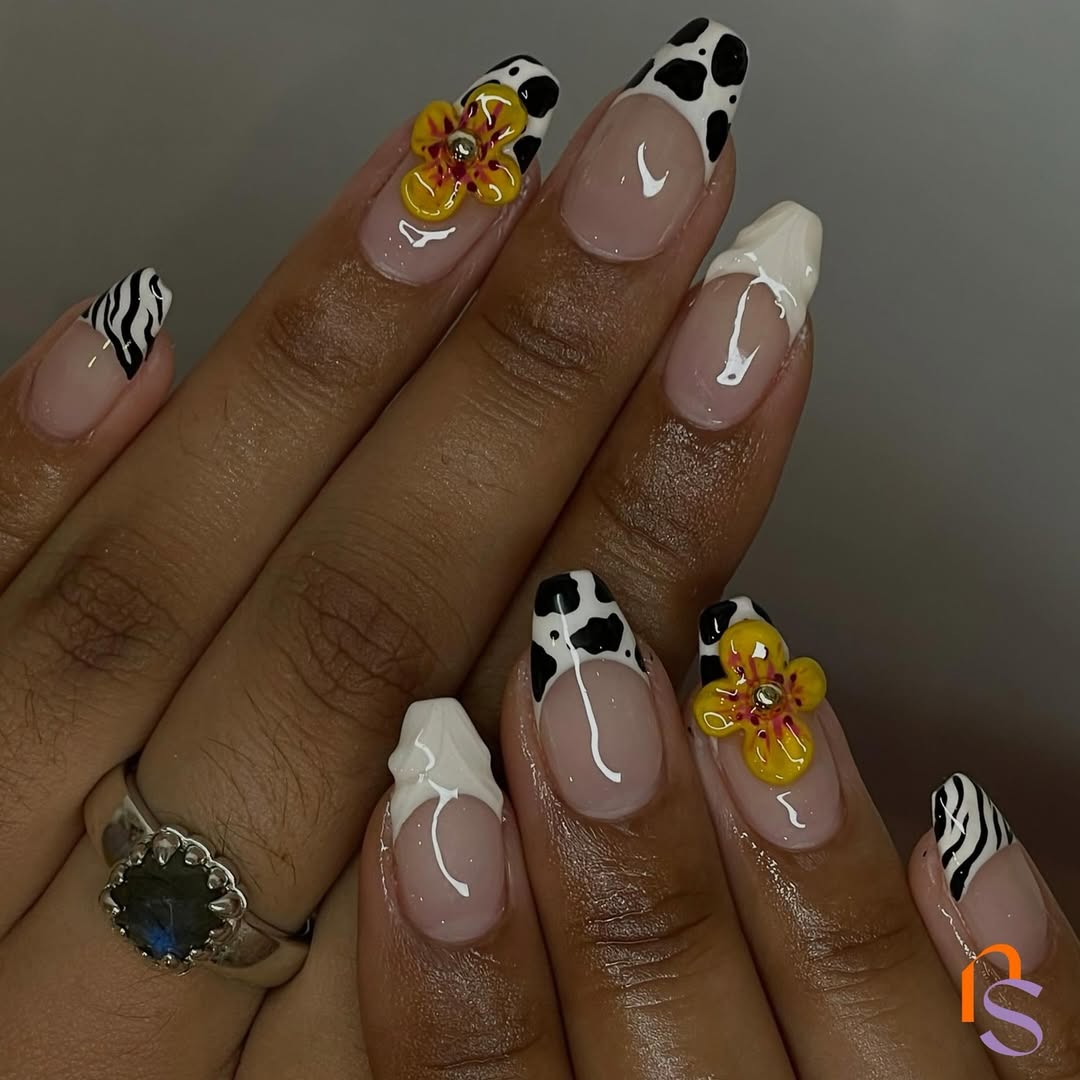 cow and zebra print french manicure with yellow flowers on short coffin nails