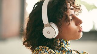 Woman wearing Beats Solo, one of the best Apple headphones