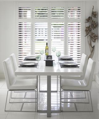 White burley shutters in dining area by Thomas Sanderson