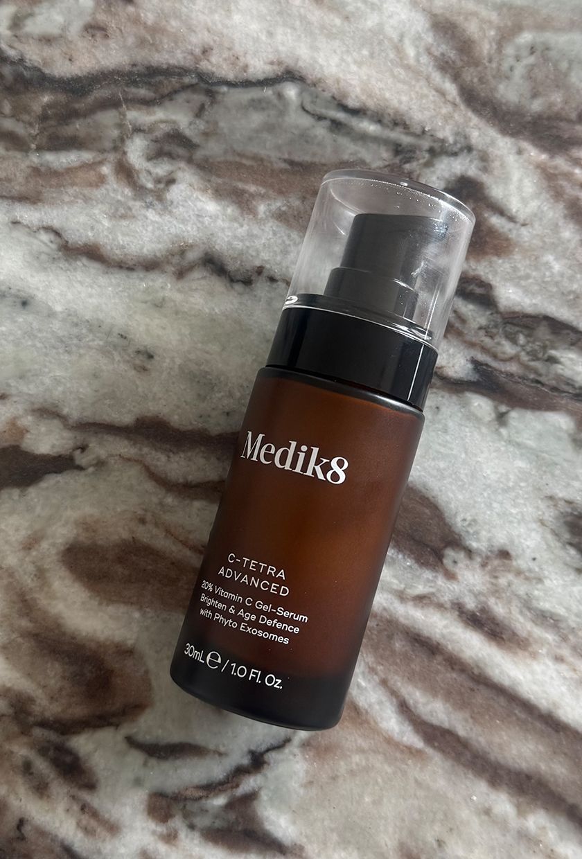 Medik8 C-Tetra Advanced Serum bottle close up on marble table