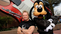 Aerosmith drummer Joey Kramer poses with Disney character Goofy at Disney's Hollywood Studios in front of the "Rock 'n' Roller Coaster Starring Aerosmith," the Walt Disney World roller coaster that is named after the band February 25, 2011 in Lake Buena Vista, Florida.