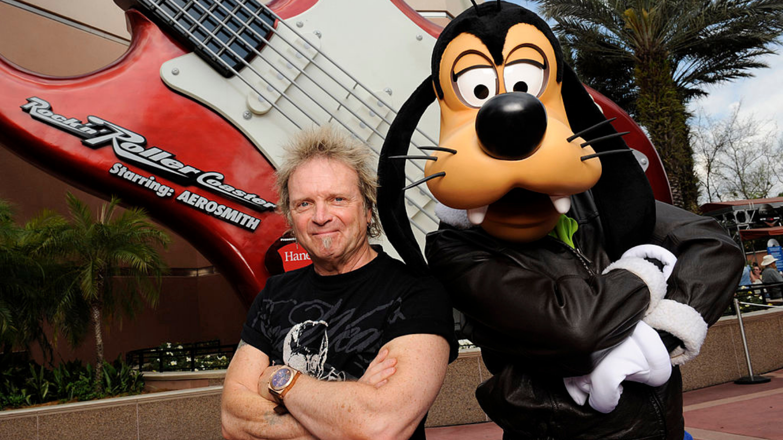 Aerosmith drummer Joey Kramer poses with Disney character Goofy at Disney&#039;s Hollywood Studios in front of the &quot;Rock &#039;n&#039; Roller Coaster Starring Aerosmith,&quot; the Walt Disney World roller coaster that is named after the band February 25, 2011 in Lake Buena Vista, Florida.
