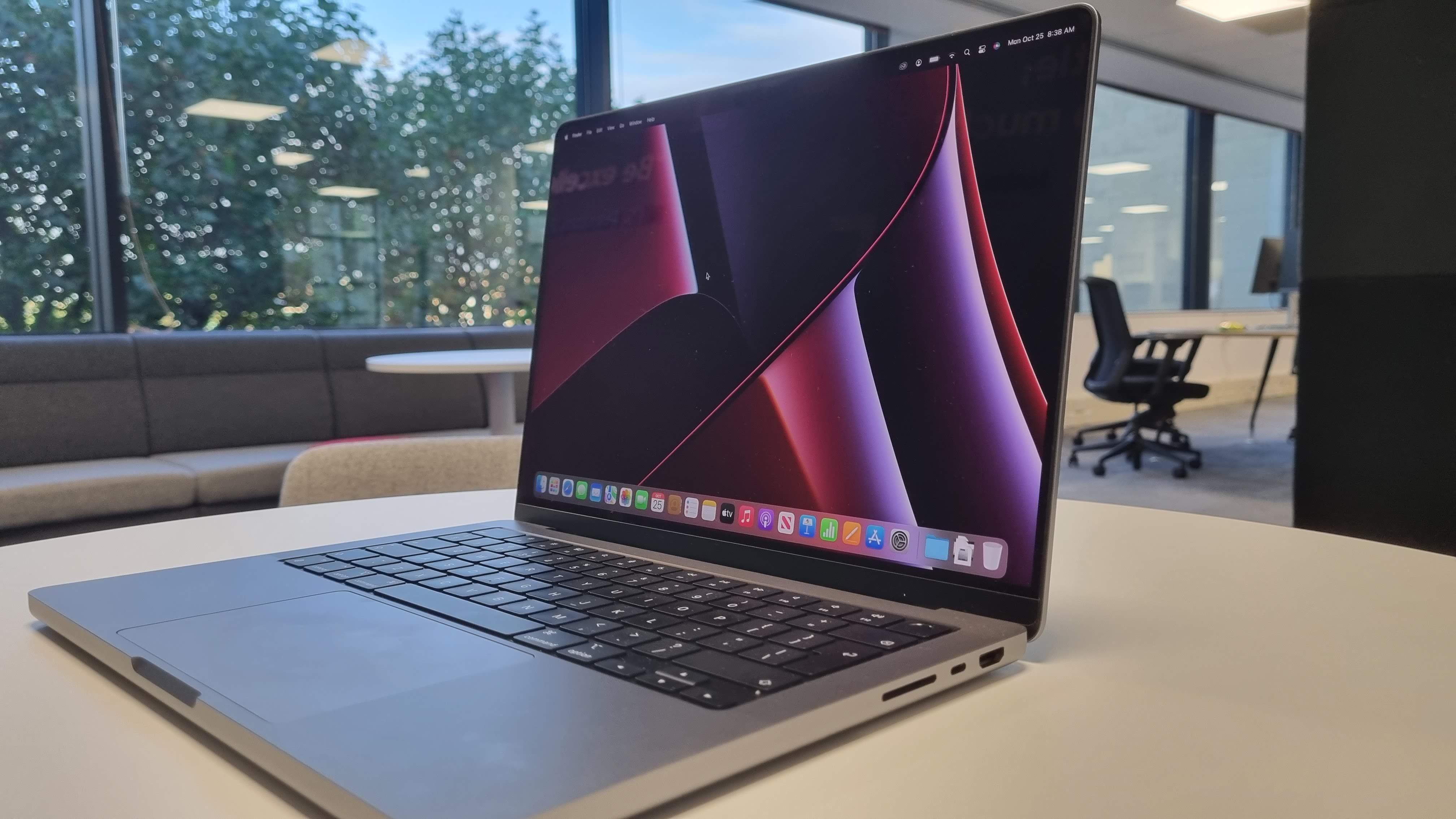 MacBook Pro 14-inch on a table in an office