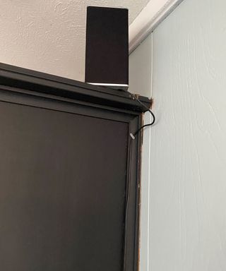 Hiding lamp cords behind a unit