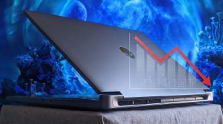 A silver Alienware laptop sits at an angle on a light surface with a blue abstract background. A bar chart graphic overlay shows a downward trend with a red arrow.