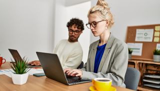 boss coworker spying on worker screen pc