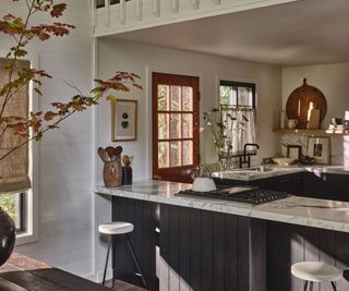 kitchen in cabin with dark cabinetry