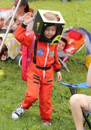 A hopeful, future astronaut celebrates the SpaceX launch attempt in person.