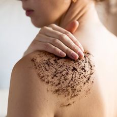 woman applying body scrub