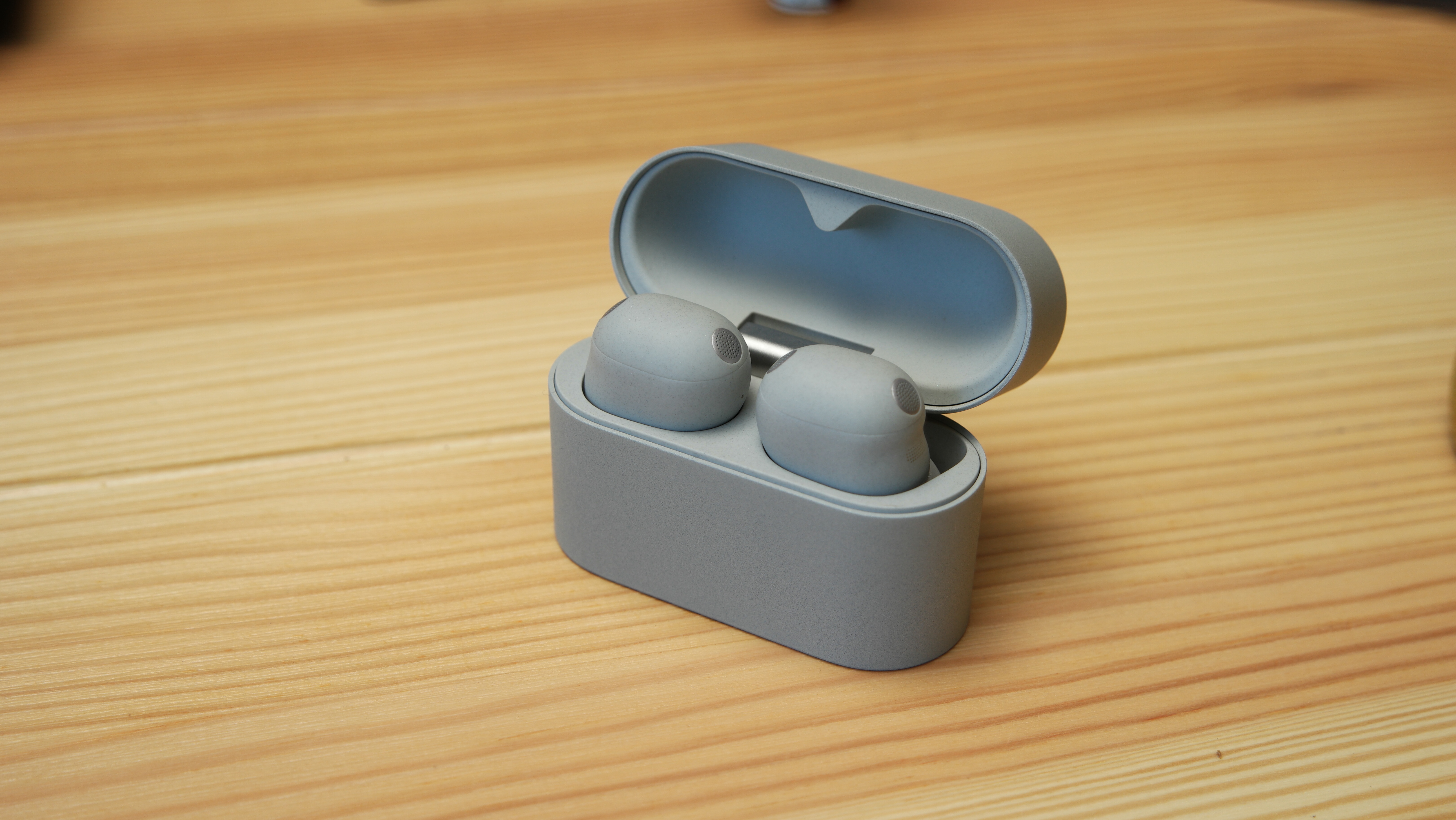 Sony WF-1000XM6 case open, displaying earbuds inside