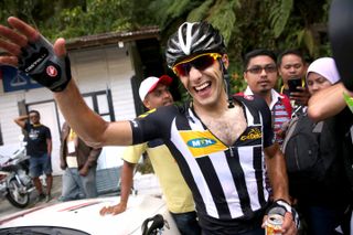 Youcef Reguigui is congratulated after his stage win