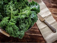 A Bowl Of Leafy Kale Plants