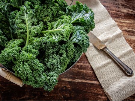 A Bowl Of Leafy Kale Plants