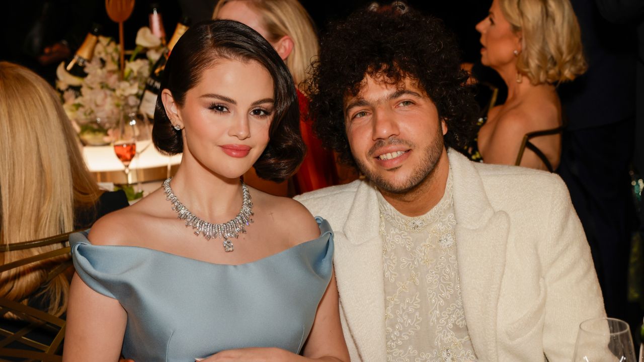 Selena Gomez in a light blue gown and Benny Blanco in a white suit at the 2025 Golden Globe Awards