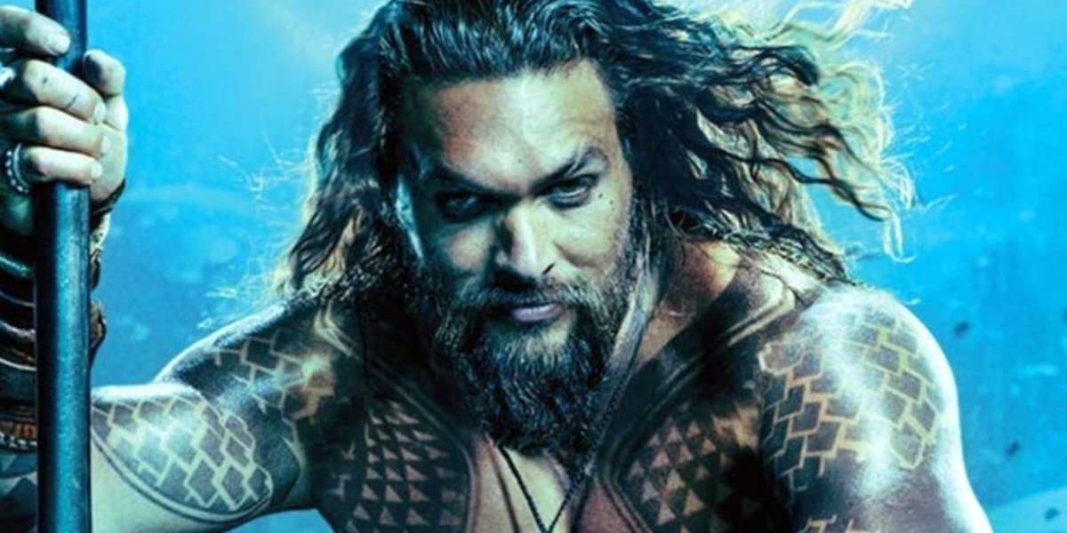 Jason Momoa close crop Aquaman poster with blue background DC