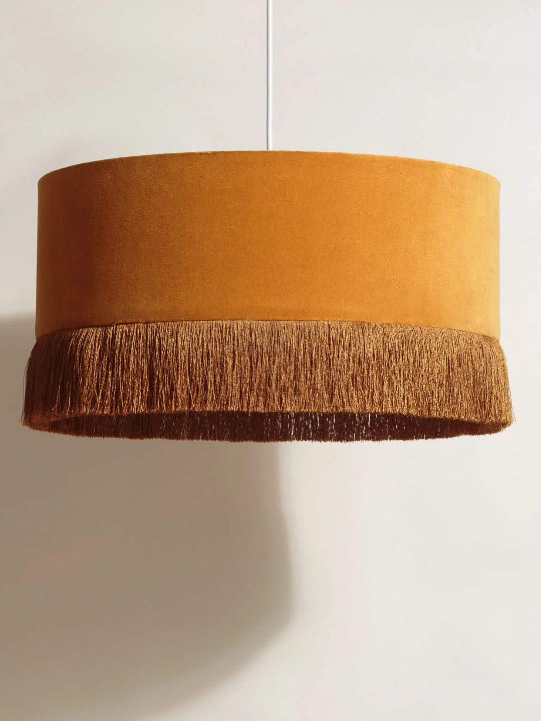 A fringe mustard pendant from Oliver Bonas
