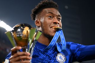 Callum Hudson-Odoi celebrates with the Club World Cup after Chelsea's victory against Palmeiras in February 2022.