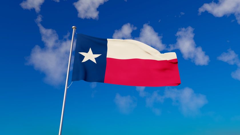 Texas flag with blue sky - stock photo