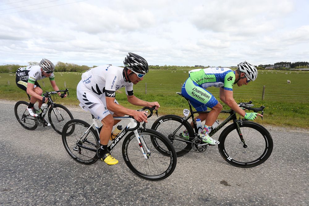 Joseph Cooper (L) of Wellington, Matt Zenovich (R) of Invercargill and Nick Bain of Auckland out front of the lead group heading to Gore during stage five of the Tour of Southland