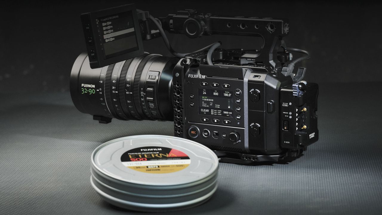 Fujifilm GFX Eterna 55 cinema camera in a darklit studio alongside an Eterna film can