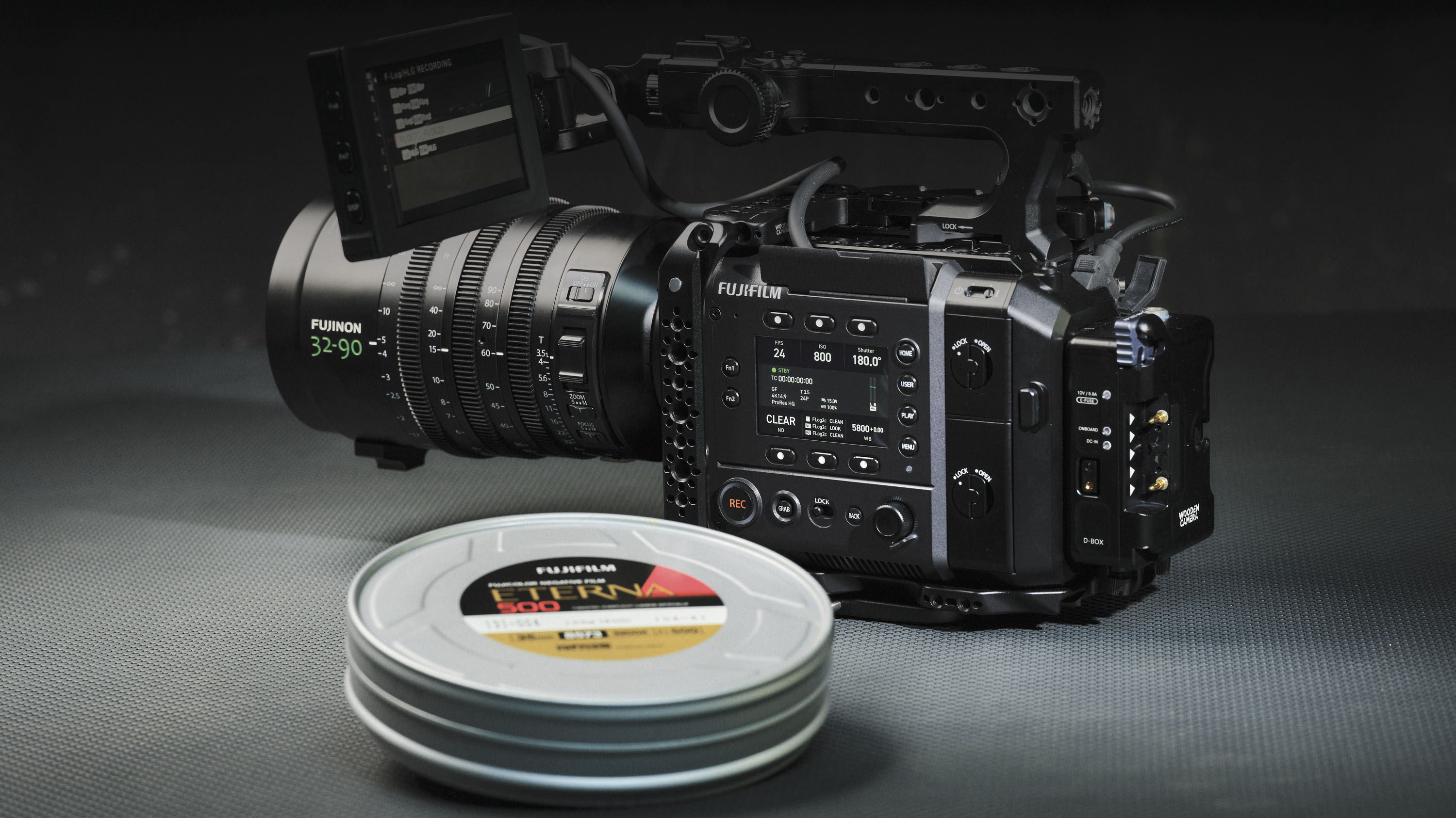 Fujifilm GFX Eterna 55 cinema camera in a darklit studio alongside an Eterna film can
