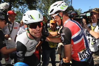 Mark Cavendish (Dimension Data) celebrates with his teammates after winning stage 14